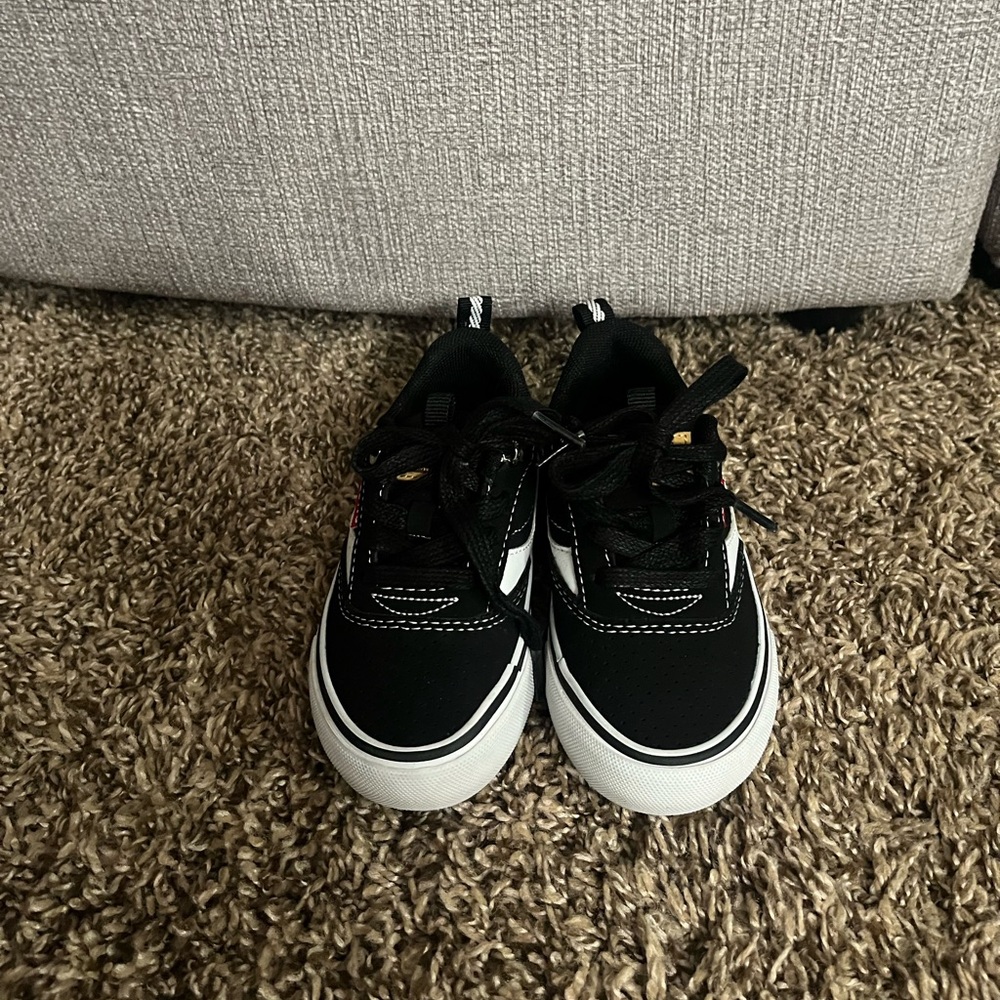 Toddler Boys size 7, black and white Levi’s shoes